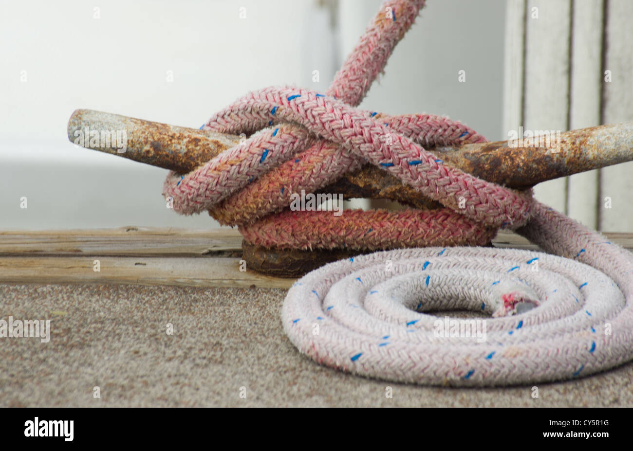 White boat fenders and dock line attached to boat Stock Photo Alamy
