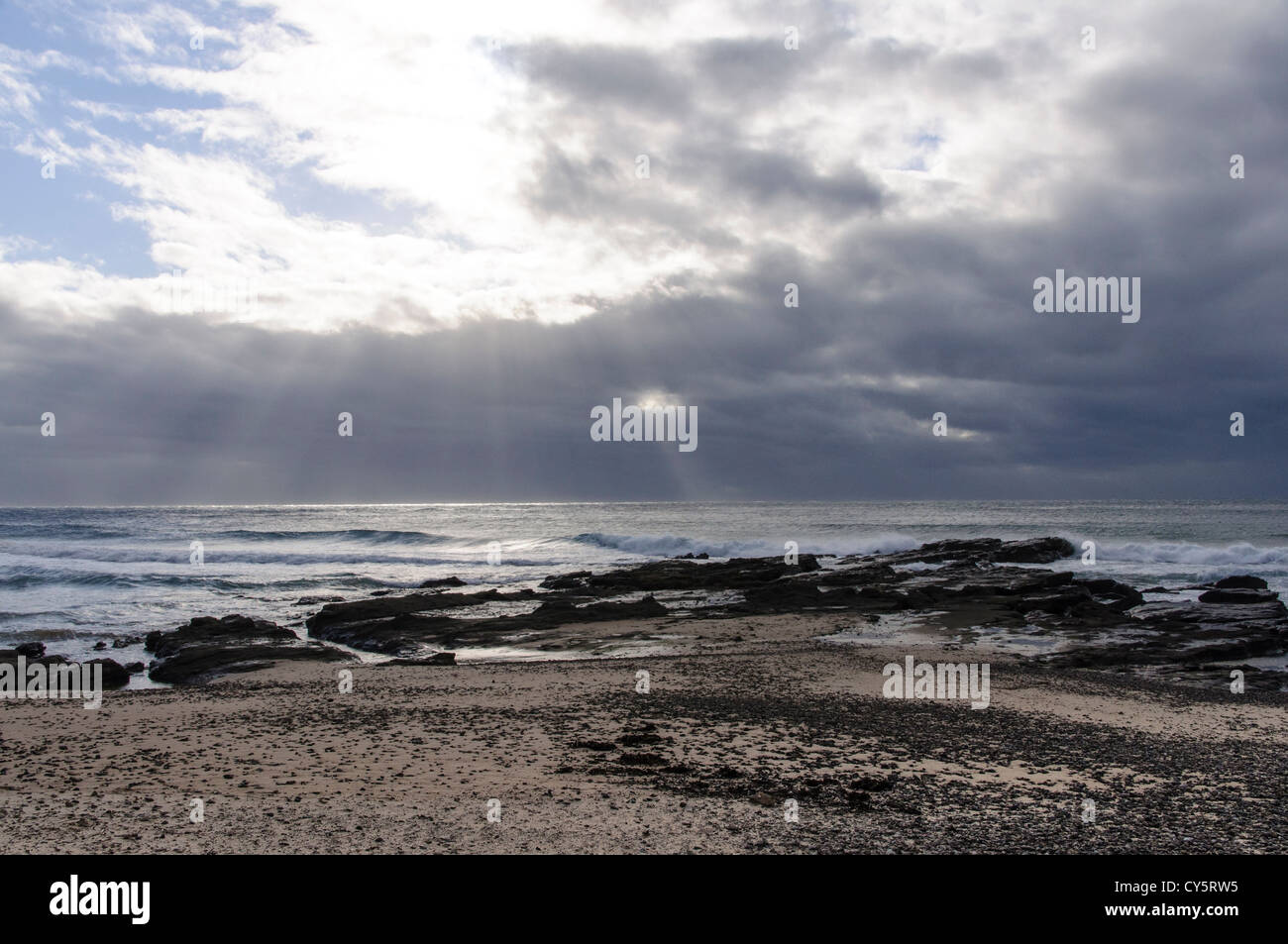 foreshore early morning and stormy clouds Stock Photo