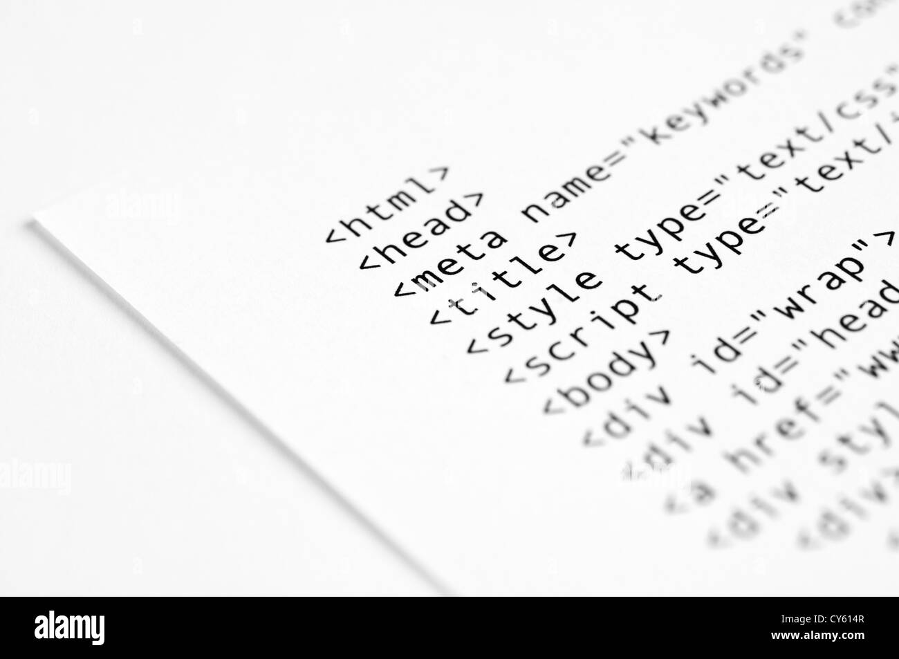 HTML script printed on white paper with shallow depth of field Stock Photo