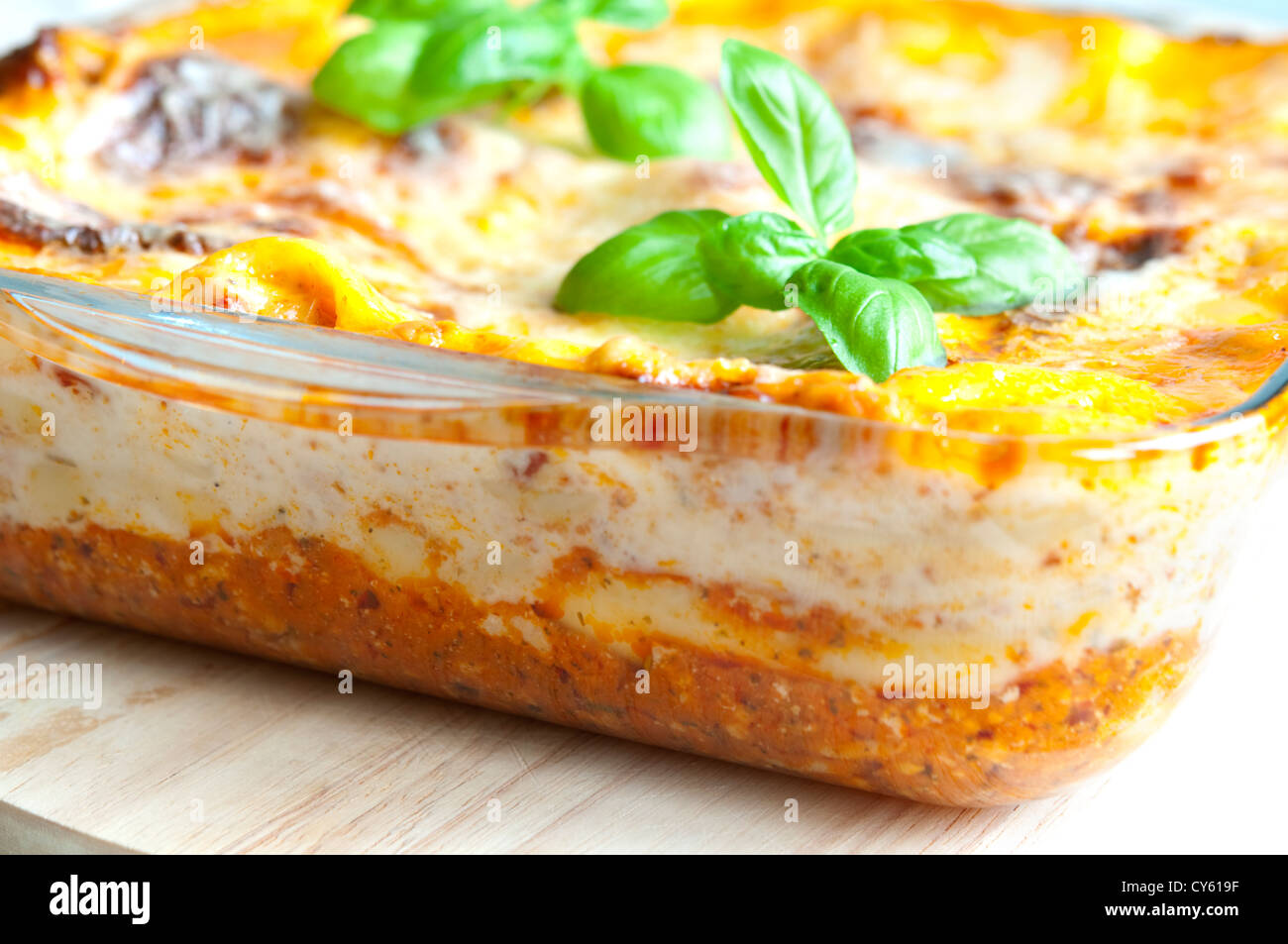 Freshly baked lasagne with fresh basil on top Stock Photo Alamy