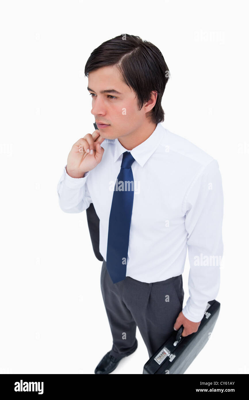 Young tradesman with his jacket and suitcase Stock Photo Alamy