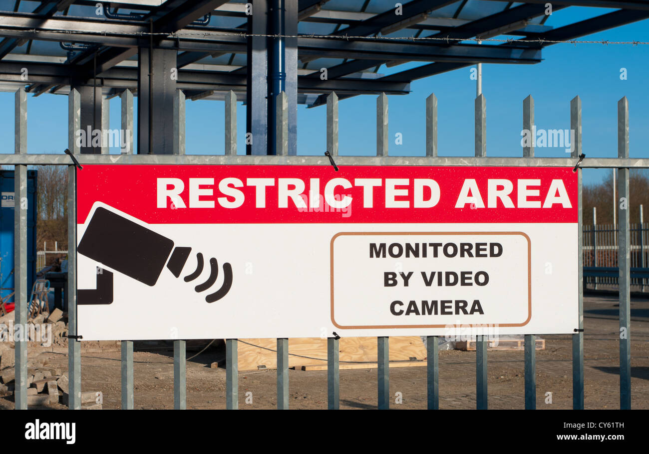 restricted area shield in front of a construction site Stock Photo