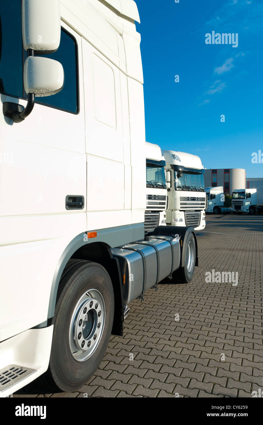 white trucks for rental on an industrial area Stock Photo