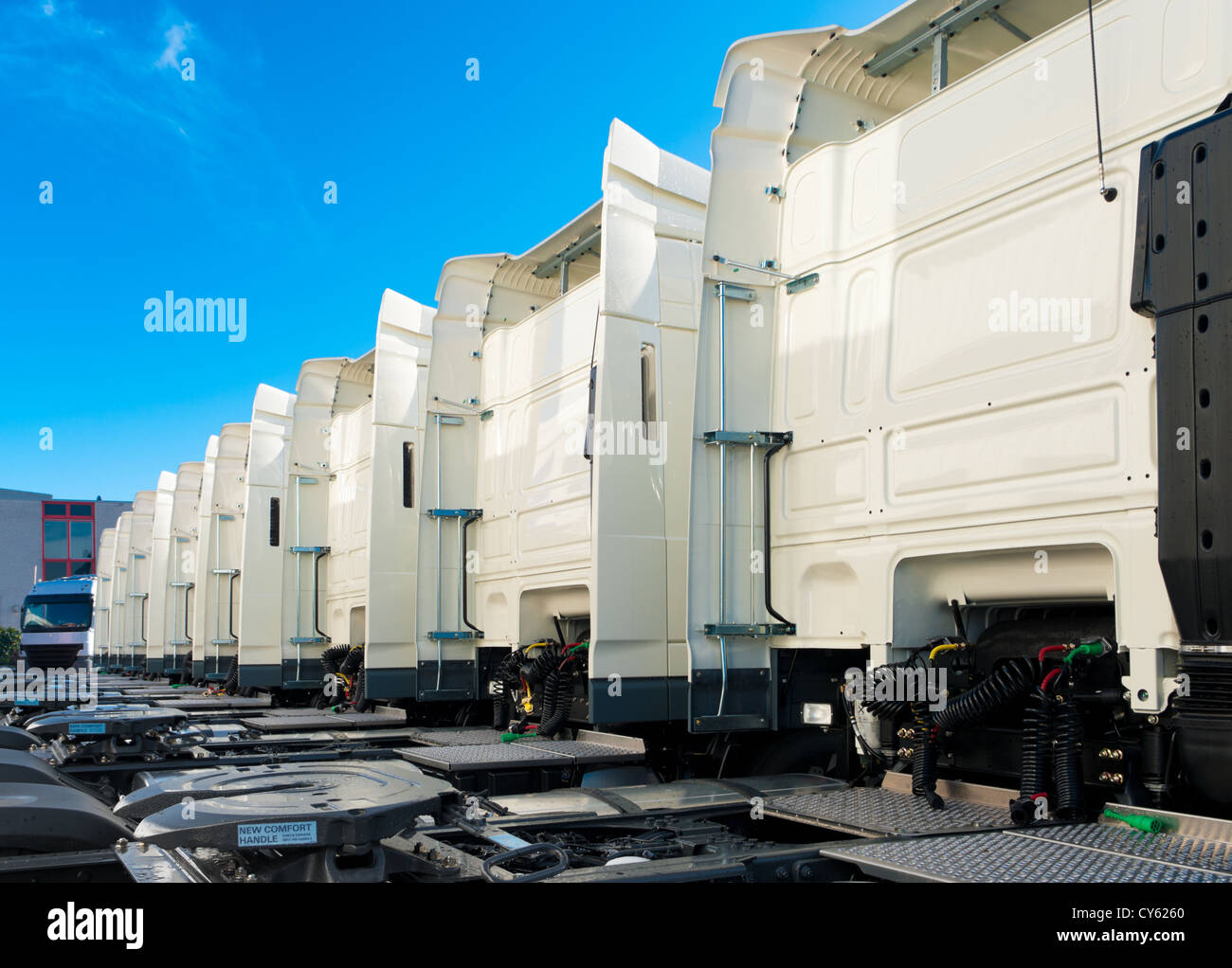 white trucks for rental on an industrial area Stock Photo