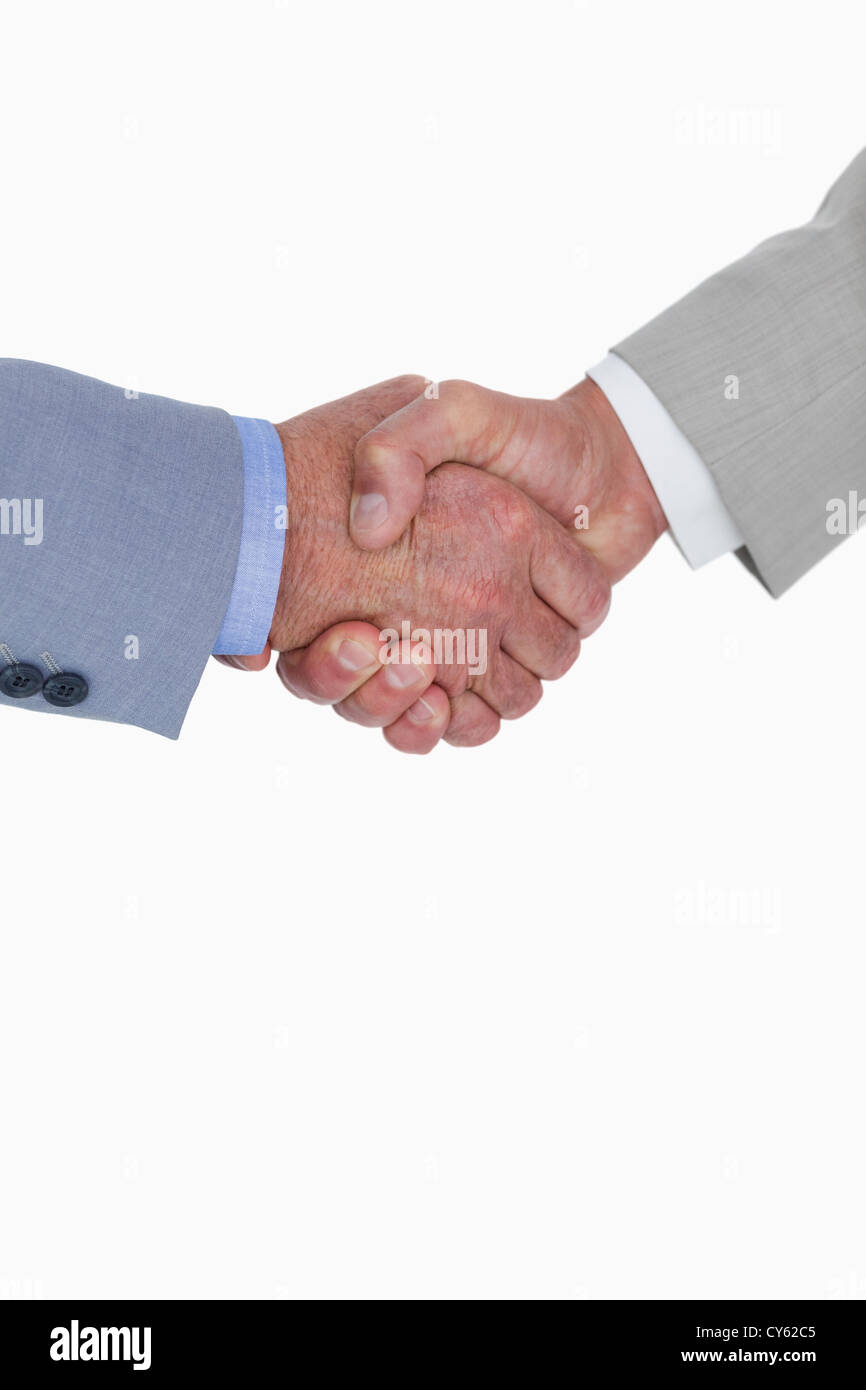 Close up side view of shaking hands Stock Photo