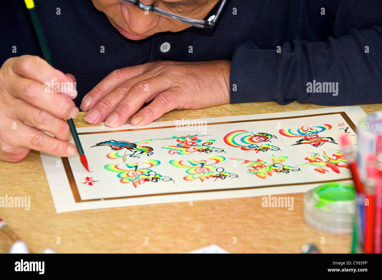 Chinese man drawing calligraphy Stock Photo
