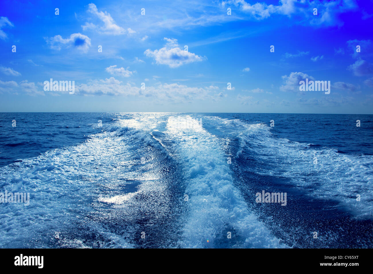 Boat wake speedy prop wash foam in blue sky at Mediterranean Stock Photo
