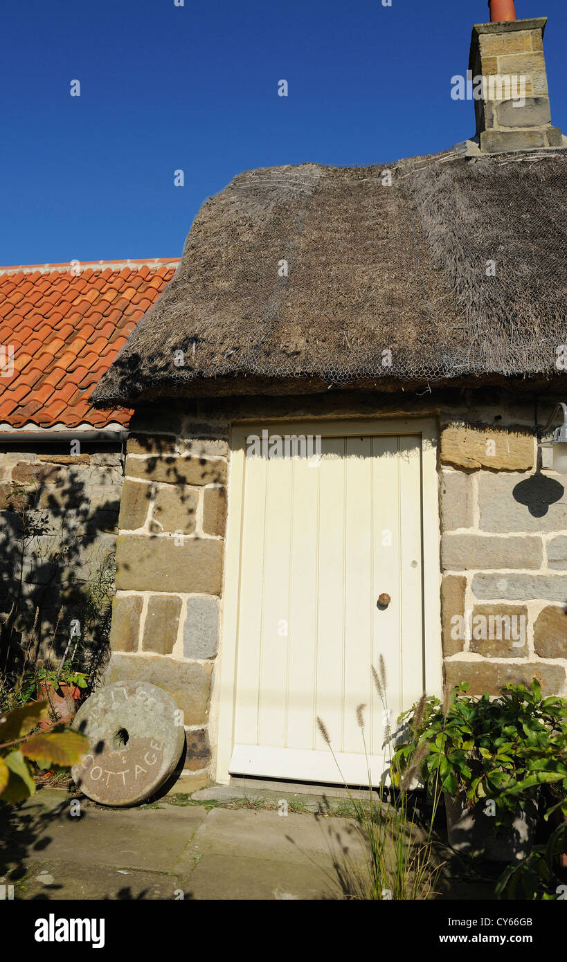 Small Farm Building With A Mixture Of Tiled And Thatched Roofs