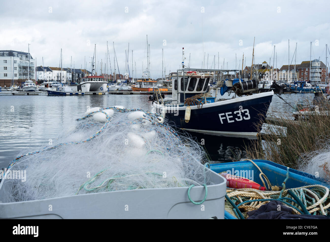 A small fishing boat in eastbourne sovereign harbour Stock Photo Alamy
