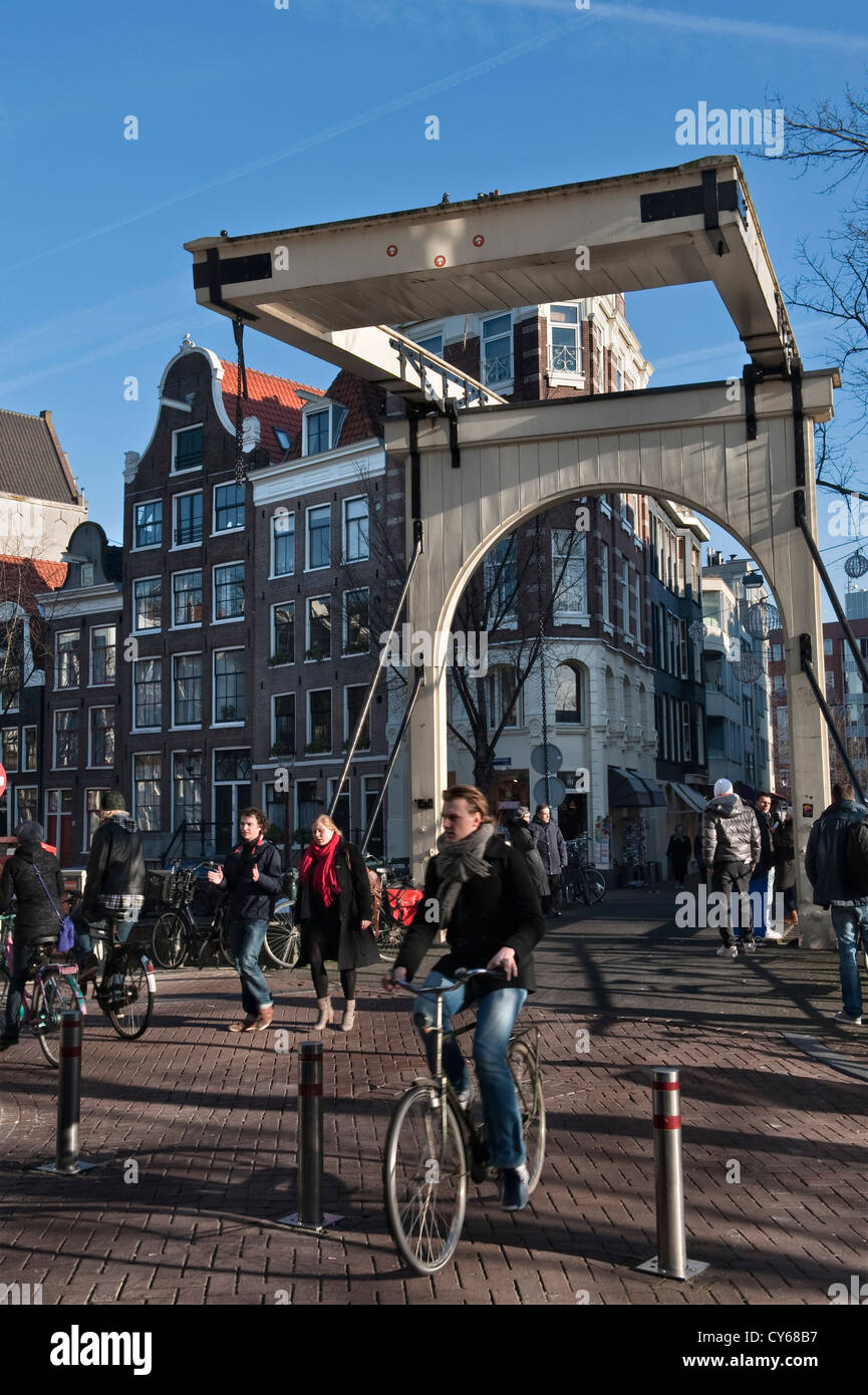 A 'balanced' bridge over the Groenburgwal canal on Staalstraat in Amsterdam city centre, the Netherlands. These are also known as bascule bridges Stock Photo