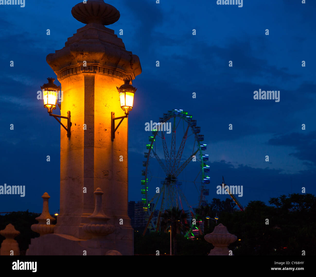 City of valencia night bridge Puente del Mar streetlights and ferry
