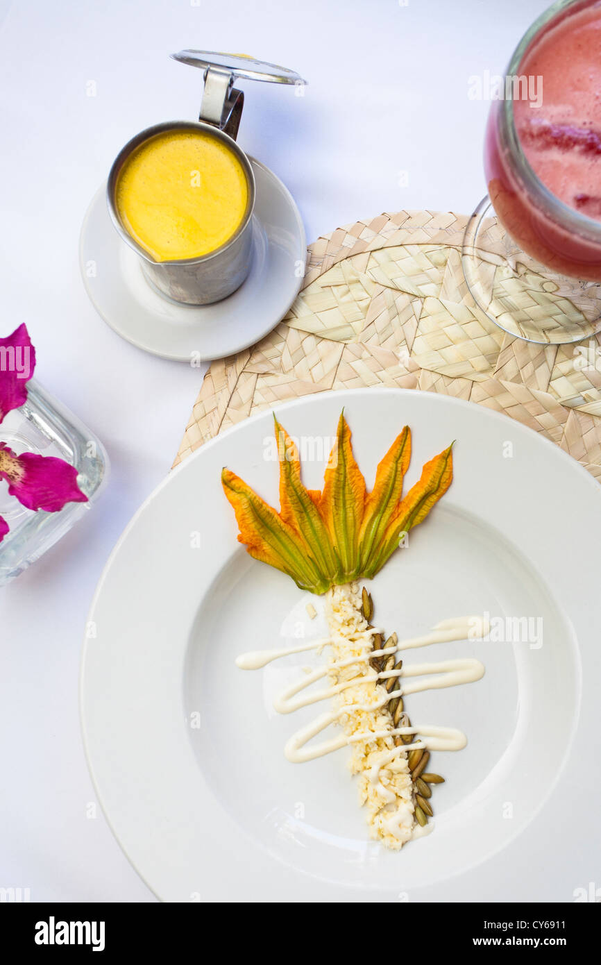Zucchini flower soup, a traditional Oaxacan dish, prepared by Chef