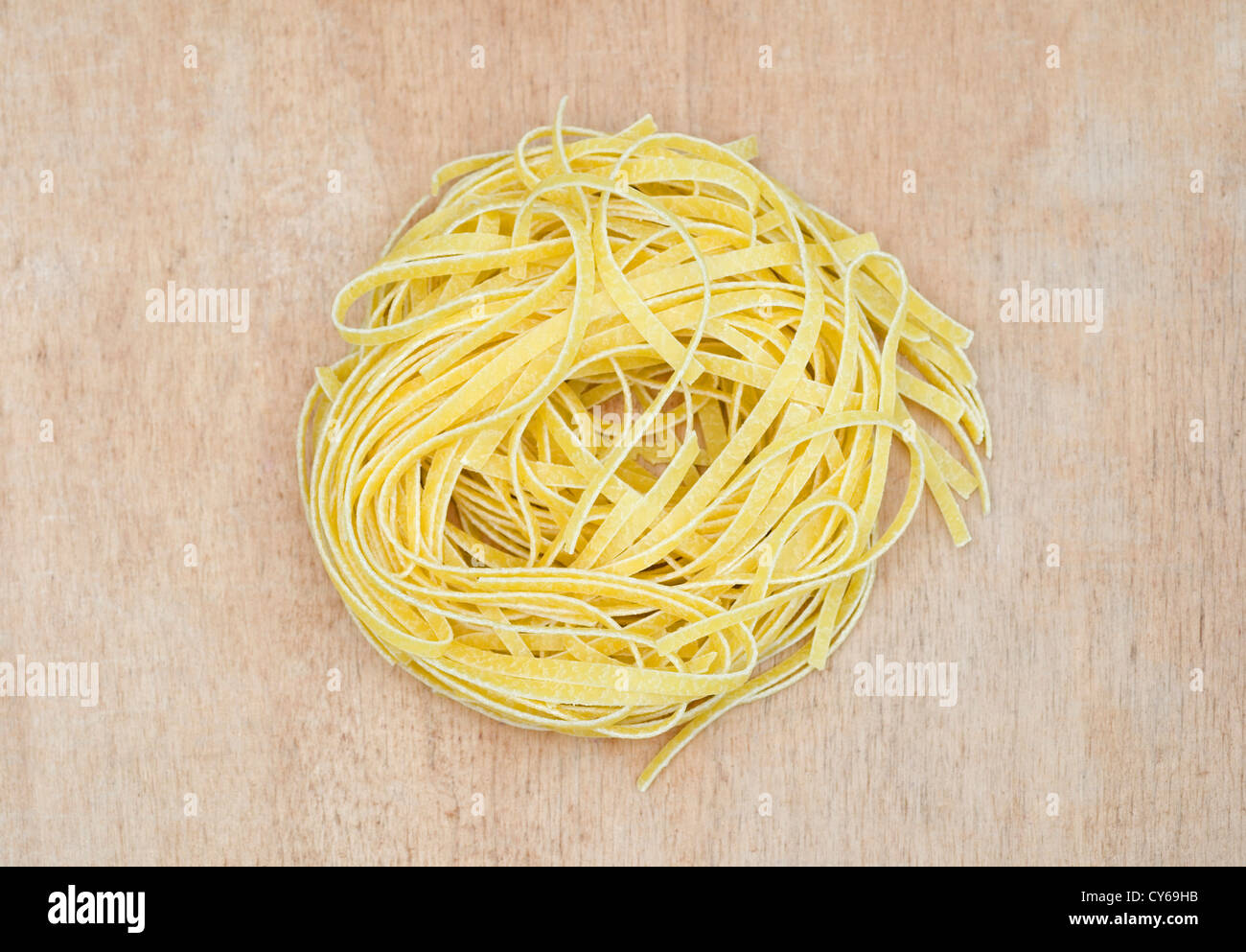Nest of dry tagliatelle pasta Stock Photo Alamy