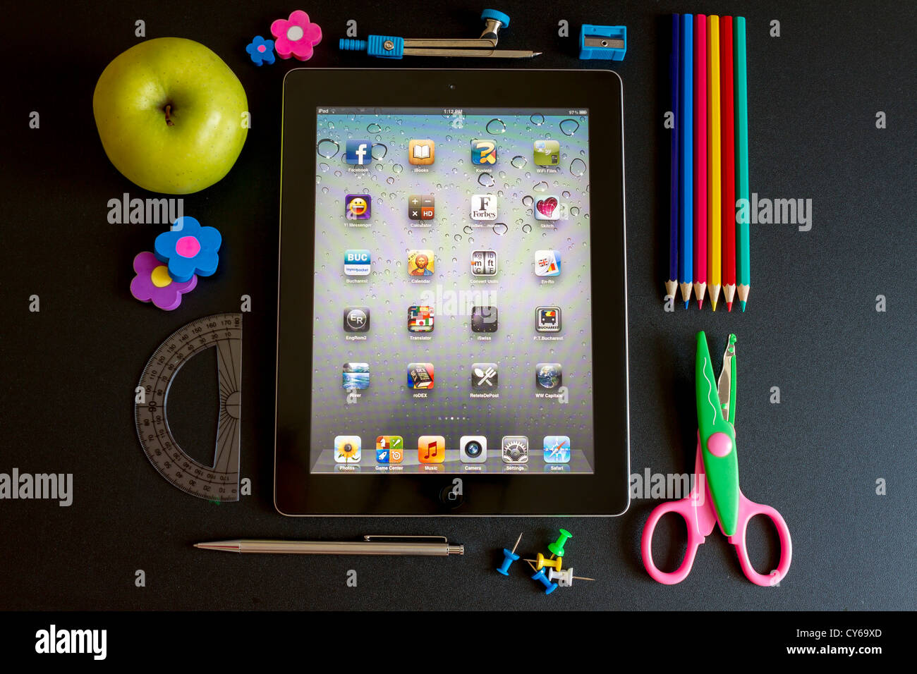 Ipad 3 with school accesories on white background Stock Photo