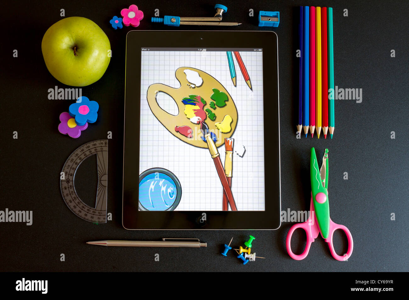 Ipad 3 with school accesories and drawing on the screen Stock Photo