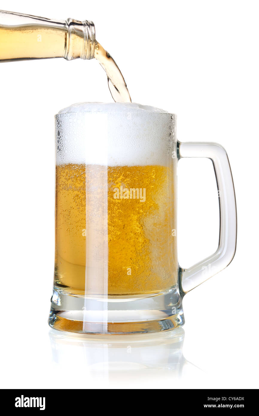 Beer collection - Beer is pouring into a glass from bottle Stock Photo