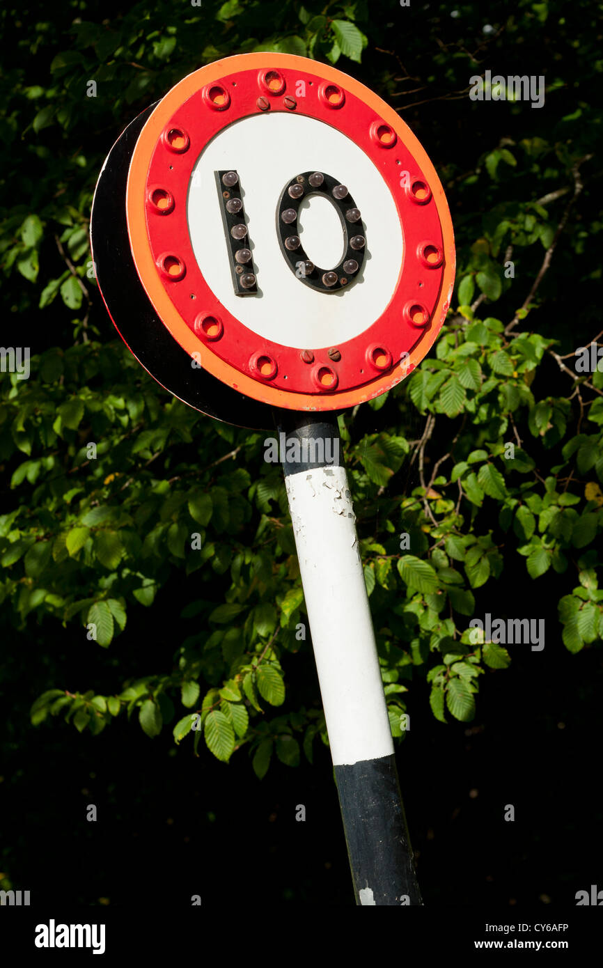 10 speed limit sign with reflectors on the numbers so that it is seen ...