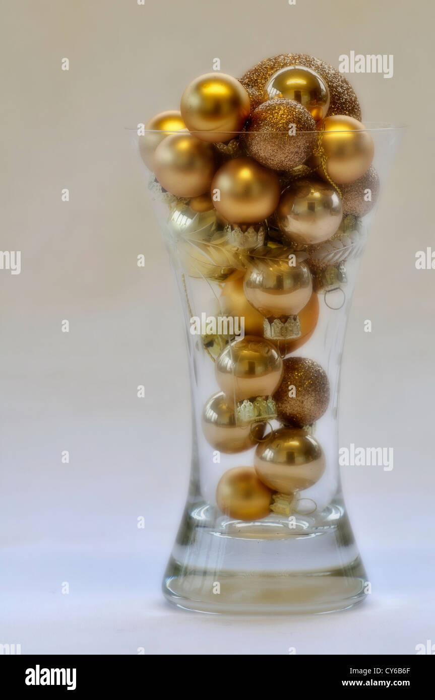 Gold Baubles In A Glass Vase Used As A Christmas Decoration Uk