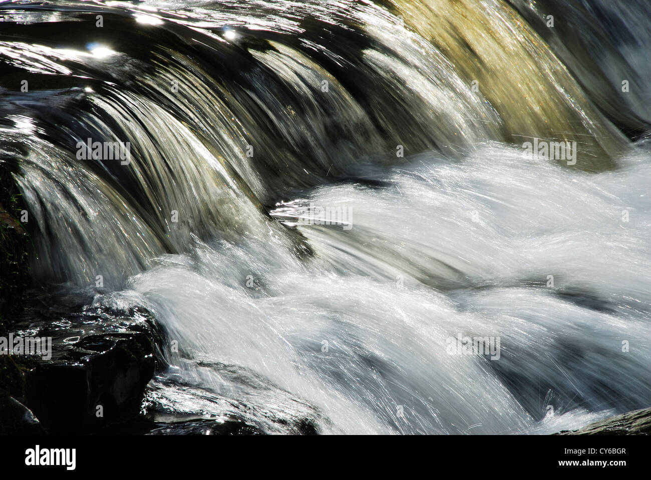A river rushing downstream UK Stock Photo