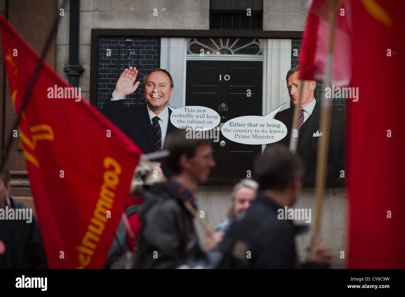 Whitehall Studios Theatre production Yes Prime Minister poster with TUC protest march passing with red flags.  Poster PM waving Stock Photo