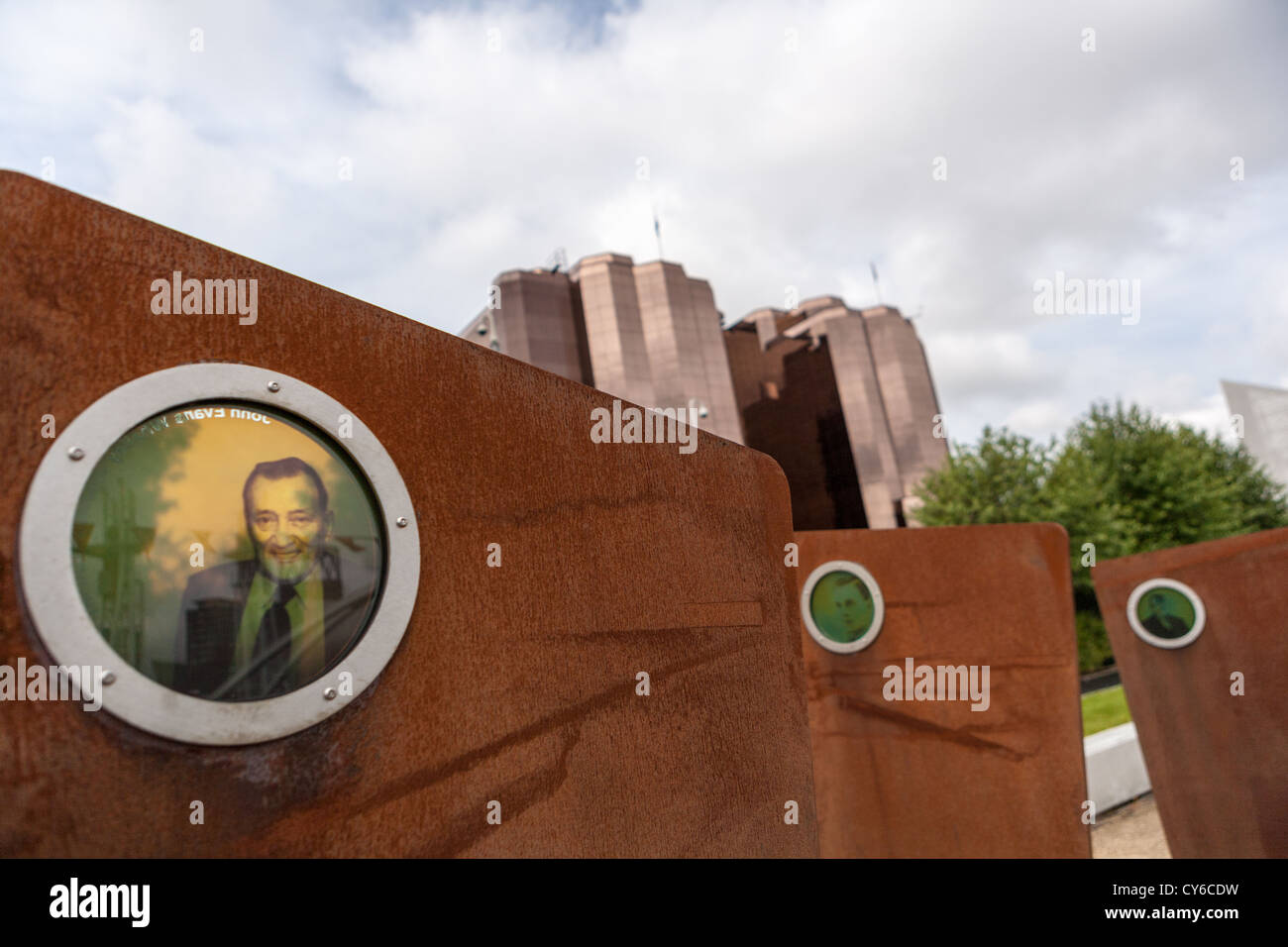 'Casuals'. The sculpture was designed to reveal conceptually the twice-daily gathering of dockers. Stock Photo