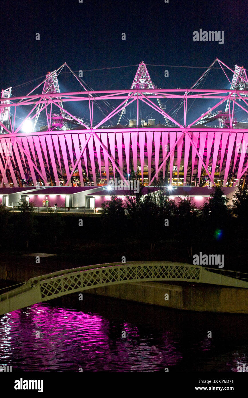 London 2012 Olympic stadium illuminated pink purple at night Stratford England Europe Stock Photo