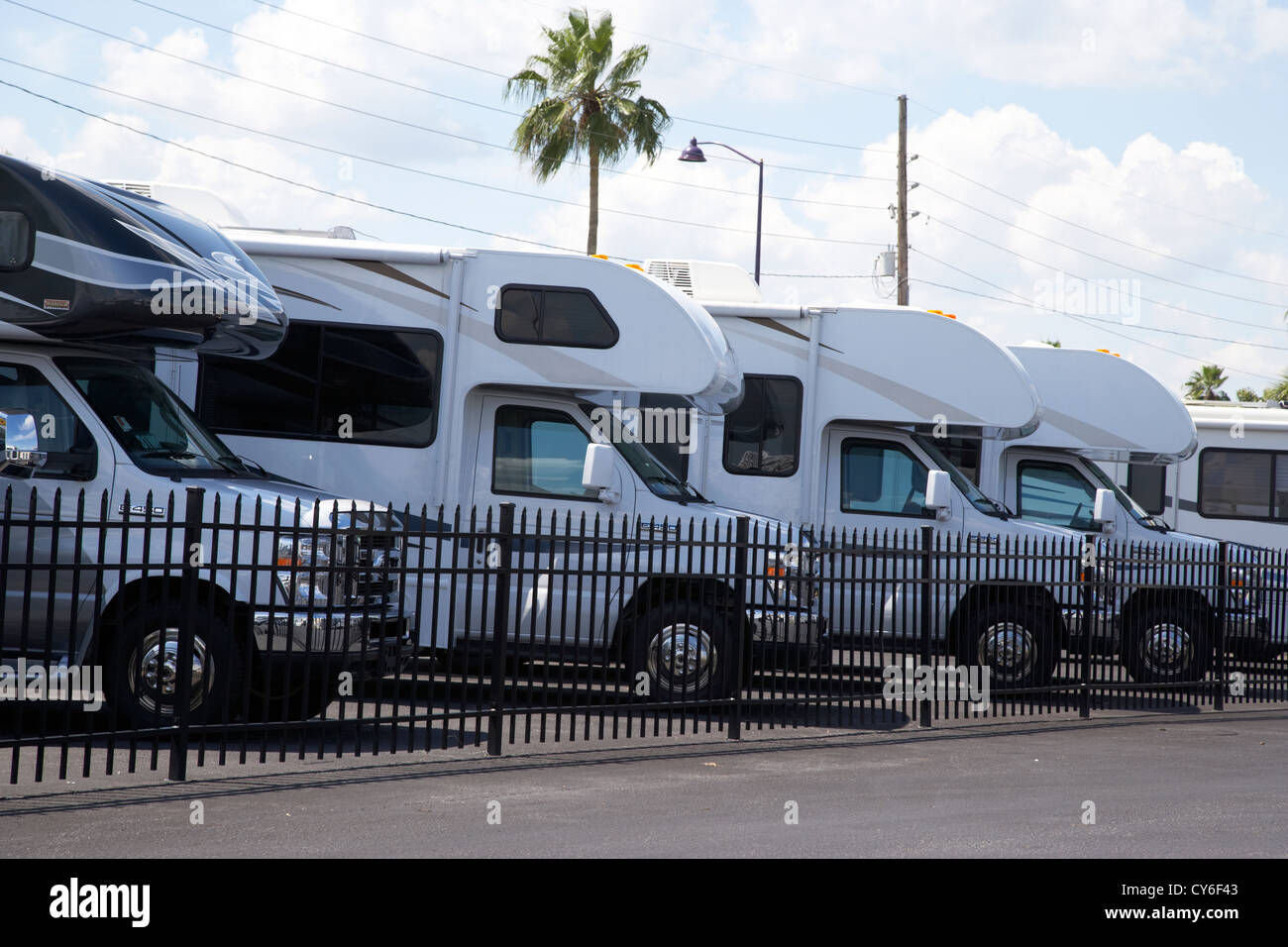 row of small motorhomes rvs for sale on a lot in florida usa Stock Photo