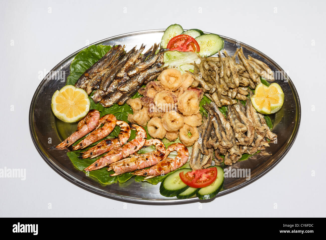 Greek food variety with various fishes, shrimps and calamari in slices Stock Photo