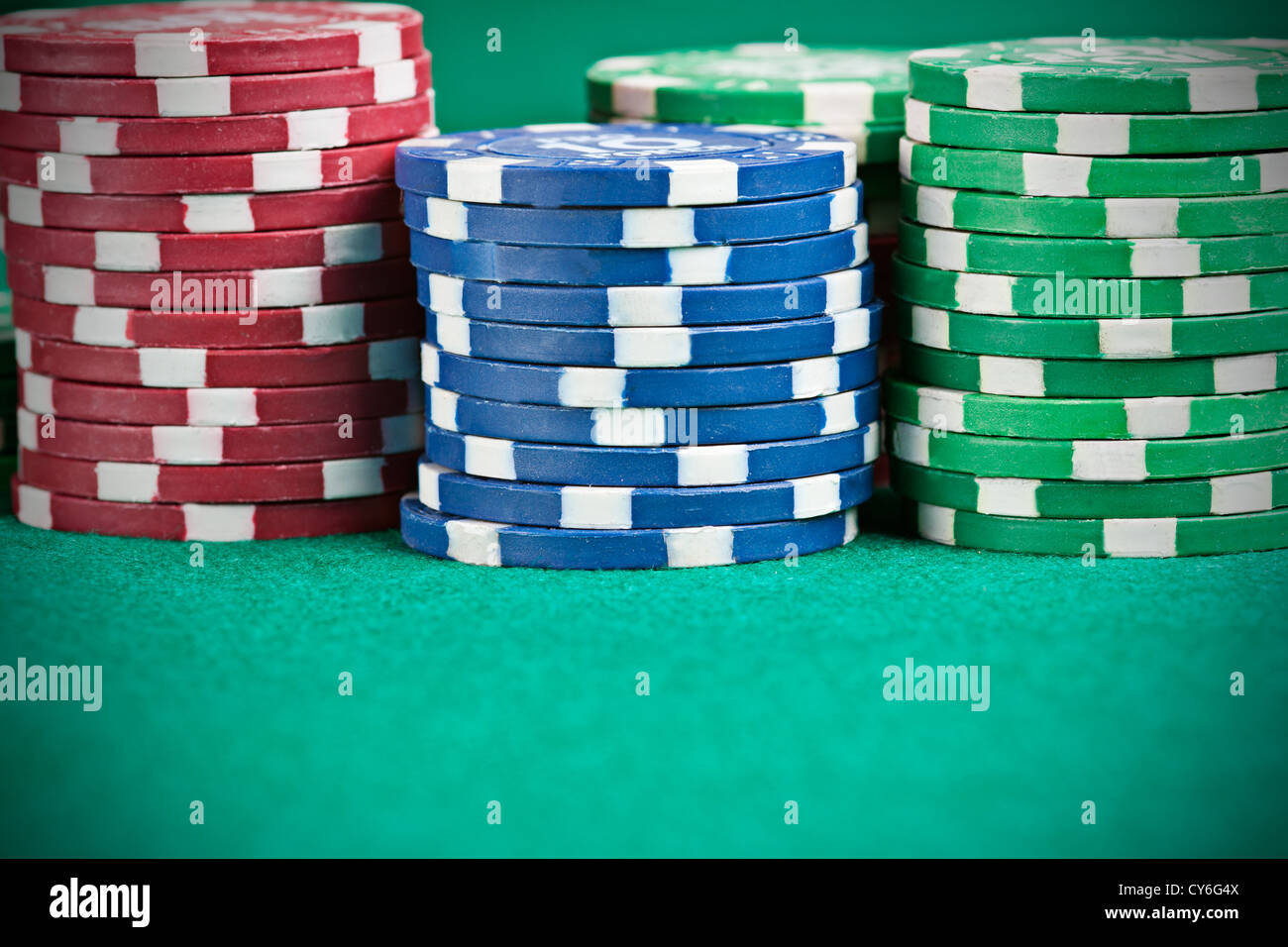 Pile of poker chips on a poker table Stock Photo