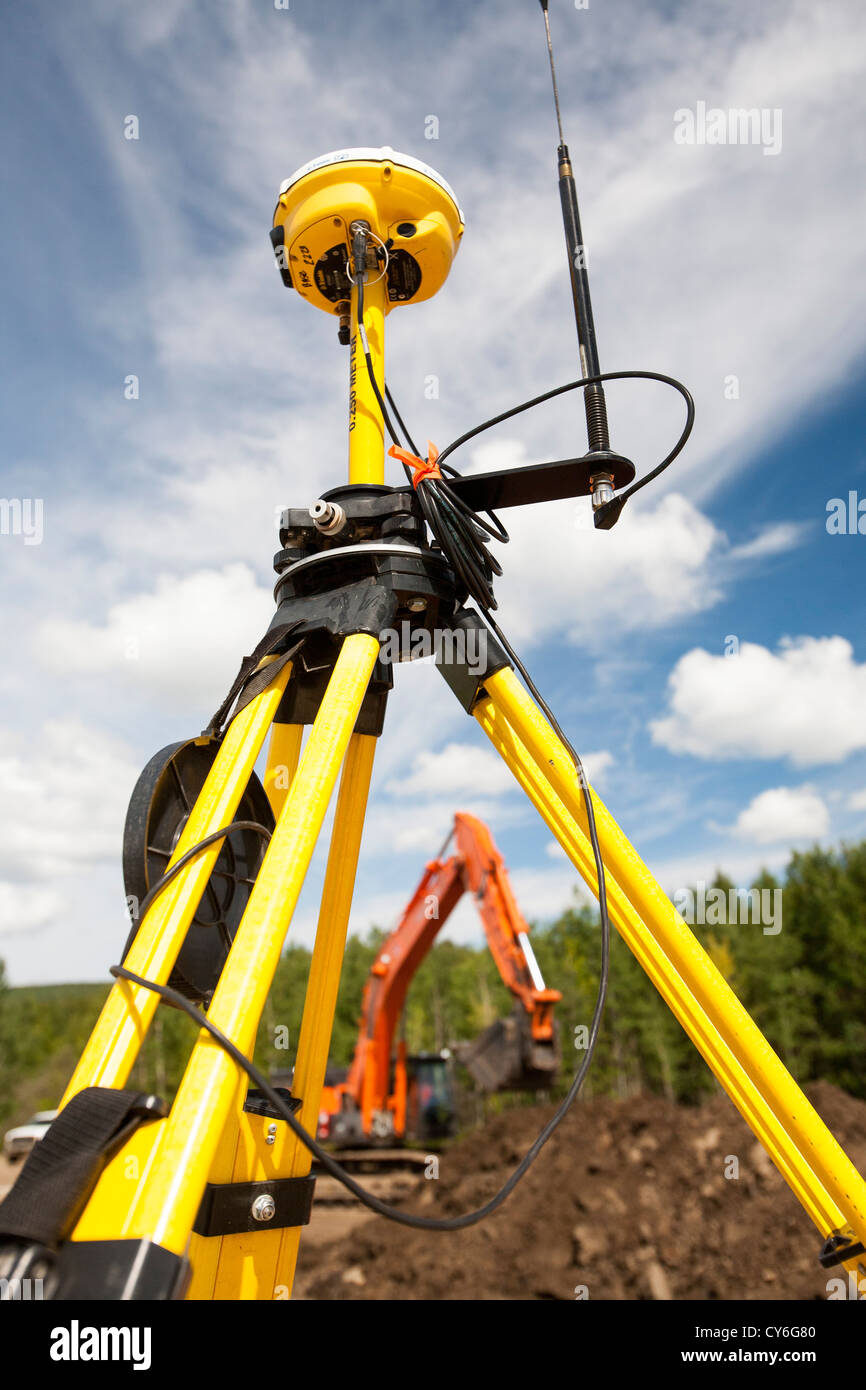 A GPS theodolite being used in new house building in Fort McMurray to house  tar sands workers Stock Photo - Alamy