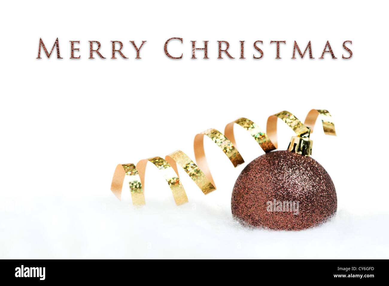 Christmas card - ball with golden ribbon on white background Stock Photo