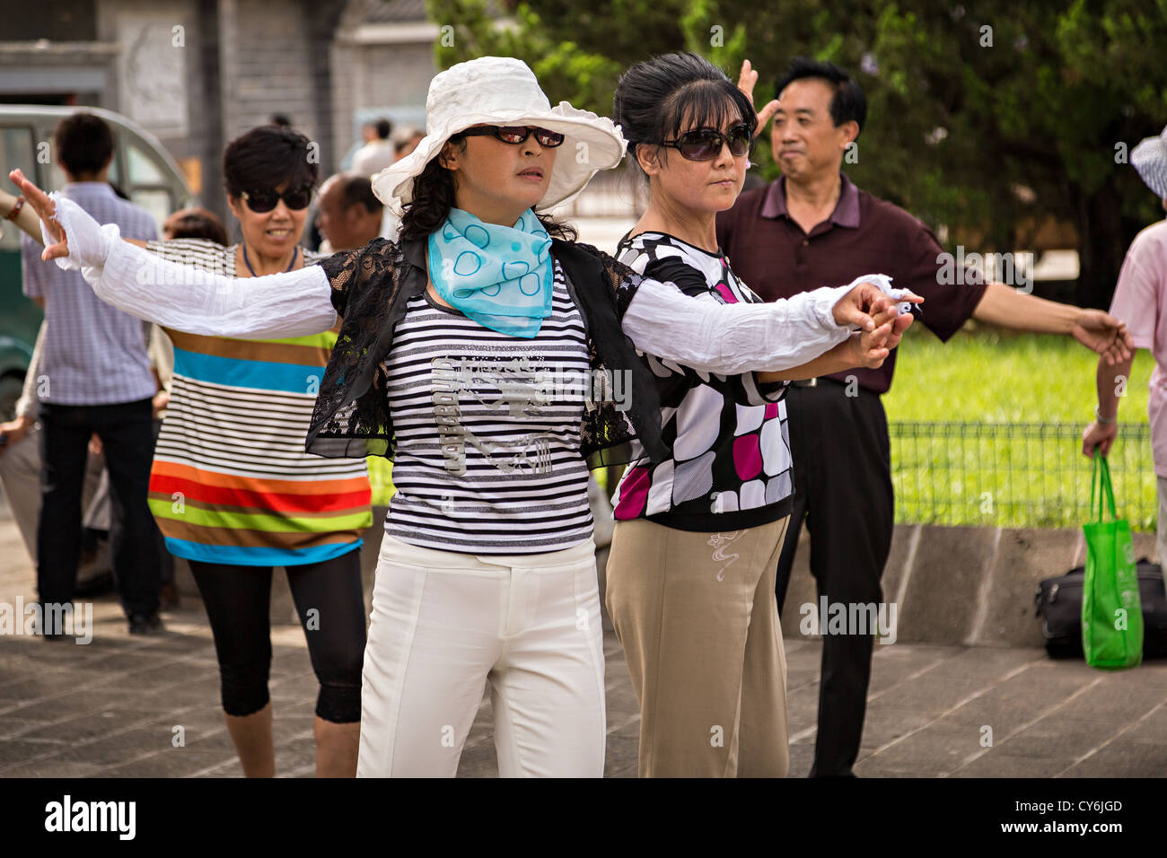 Chinese people dance at the Temple of Heaven Park during summer in Beijing, China Stock Photo