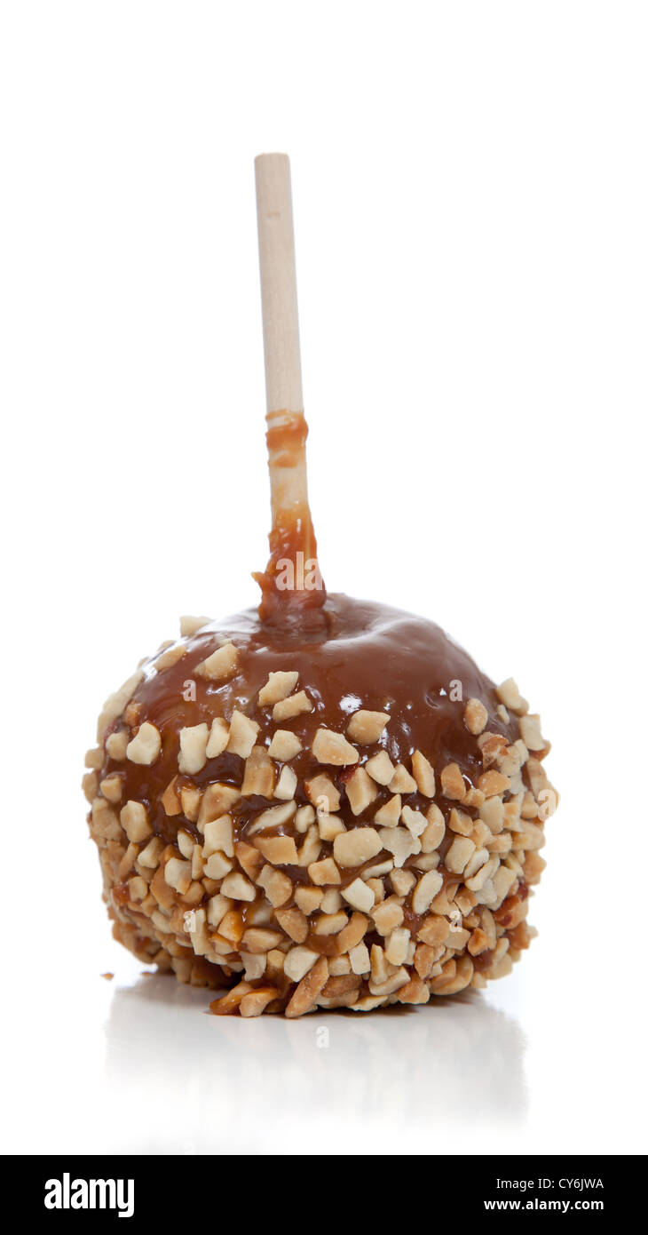 A caramel or candied apple with nuts on a white background Stock Photo