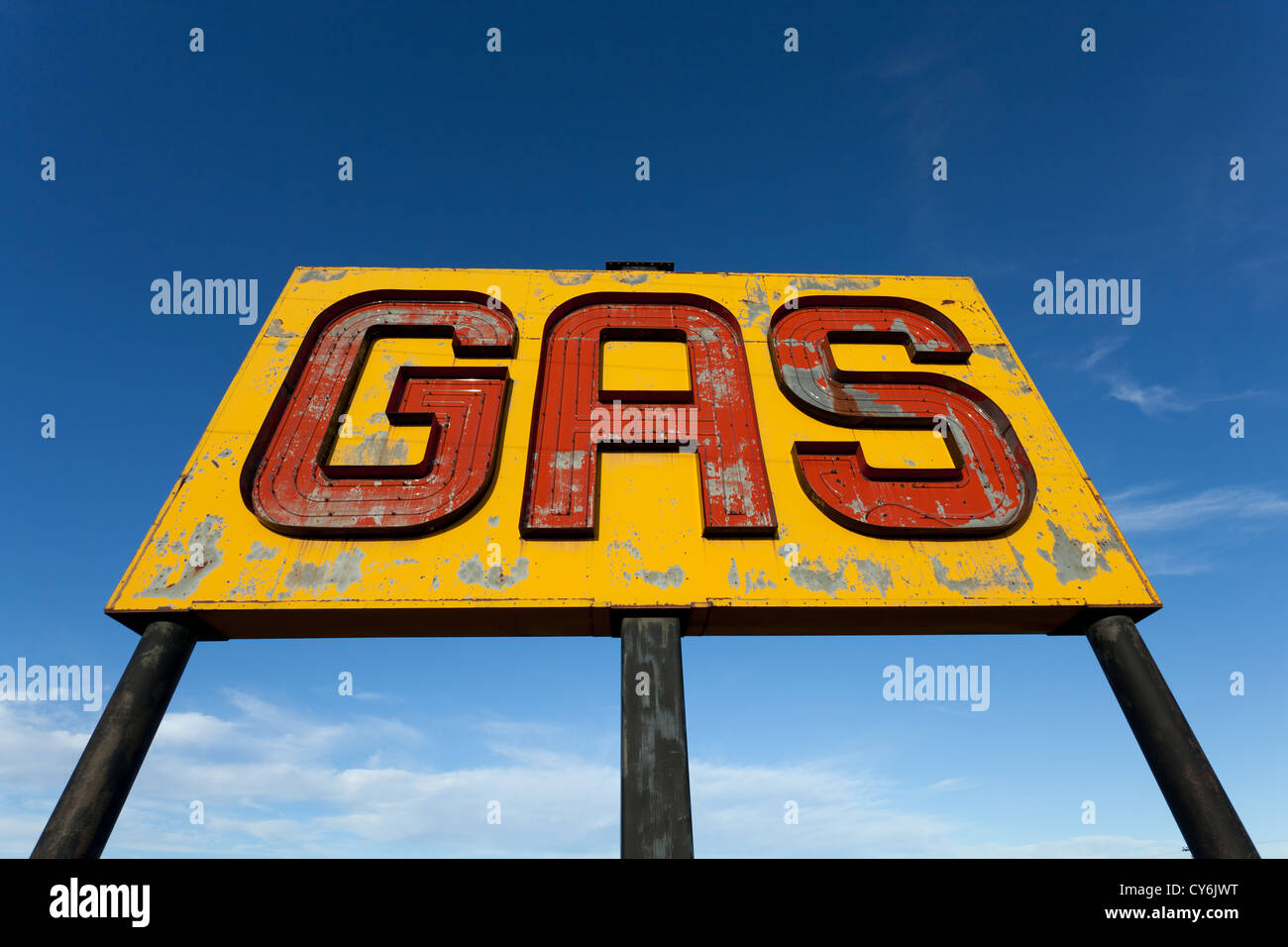 A vintage gas sign on a sky blue background Stock Photo - Alamy