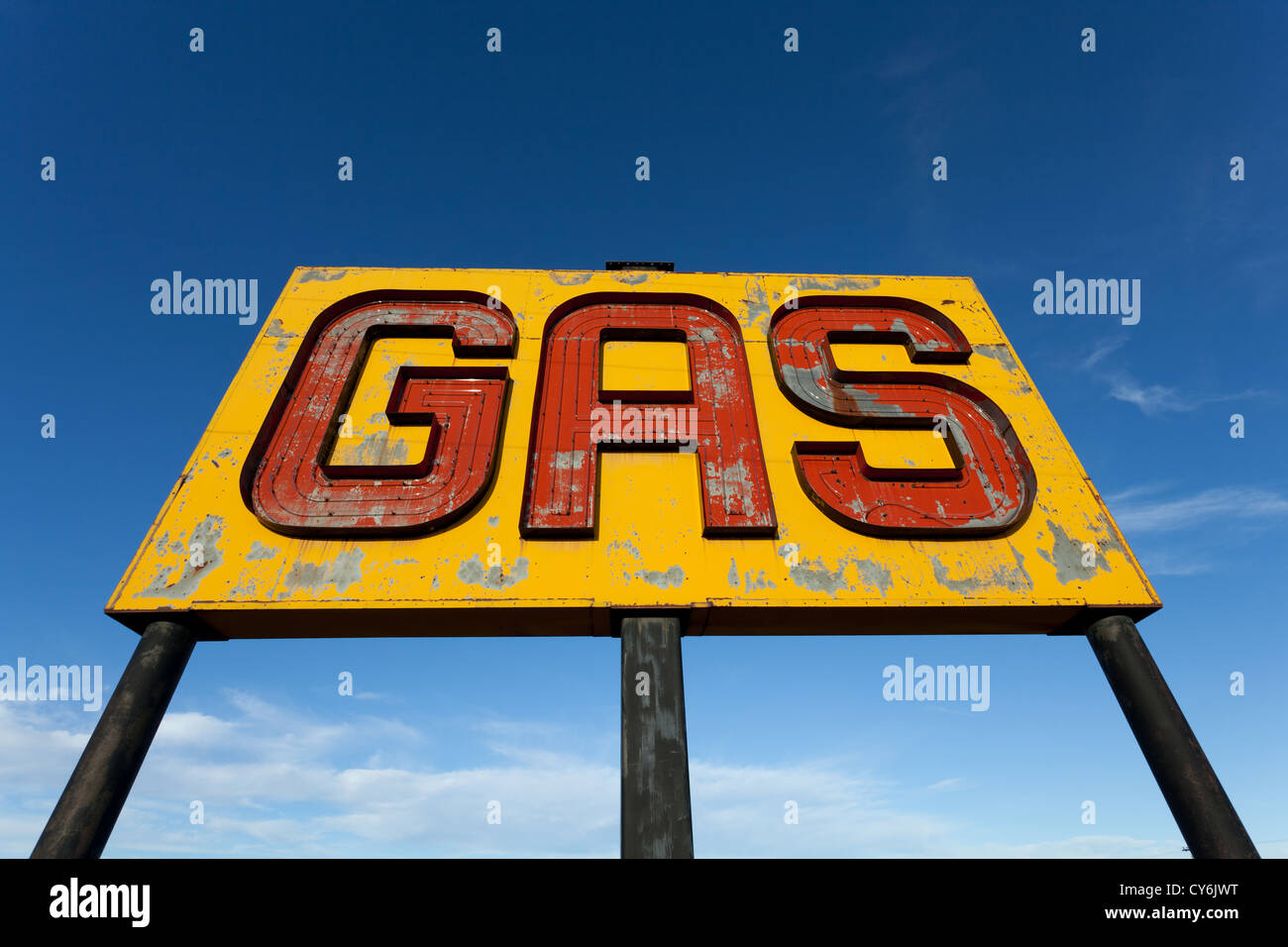 A vintage gas sign on a sky blue background Stock Photo
