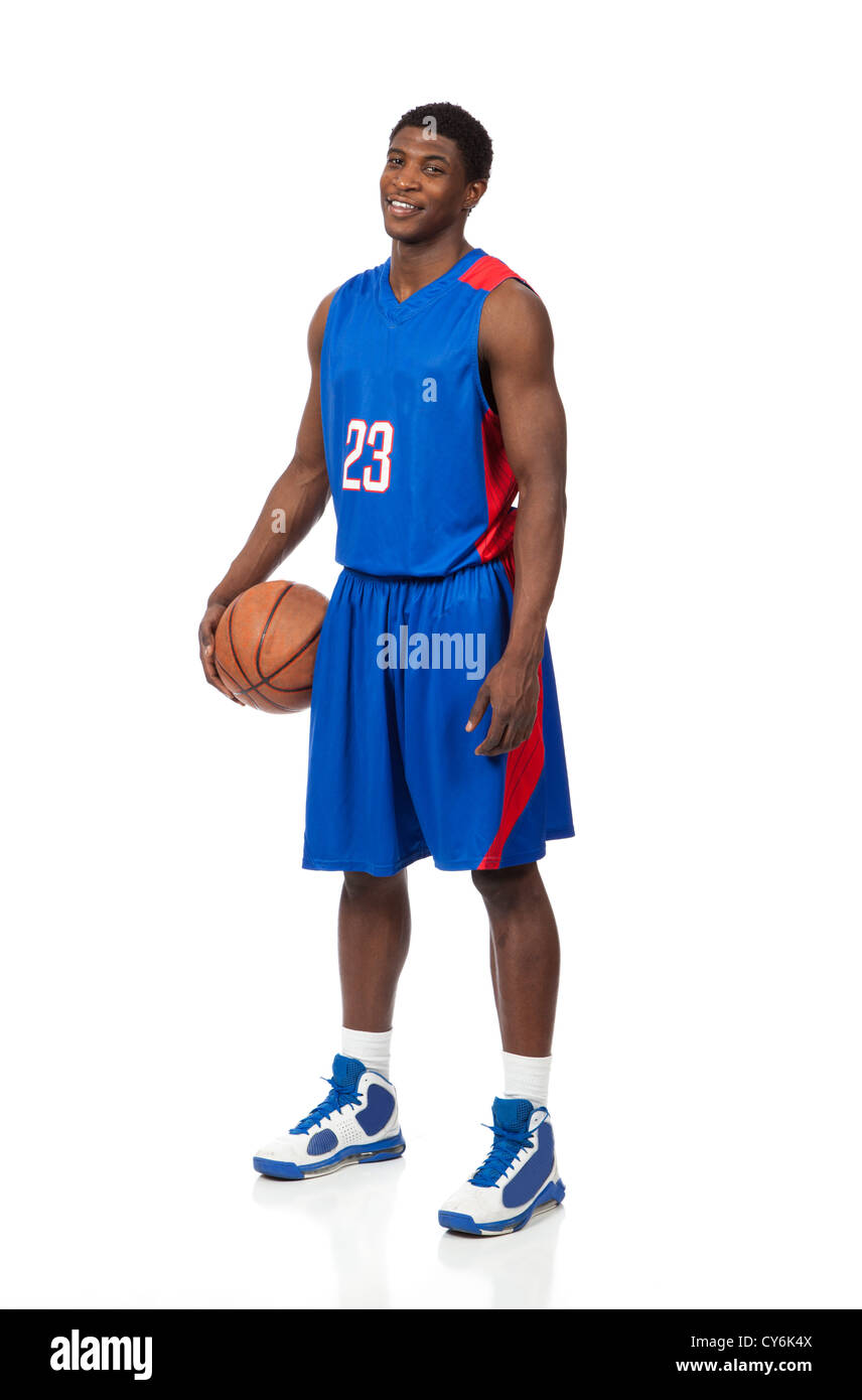 An African American basketball player holding a basketball on a white background Stock Photo