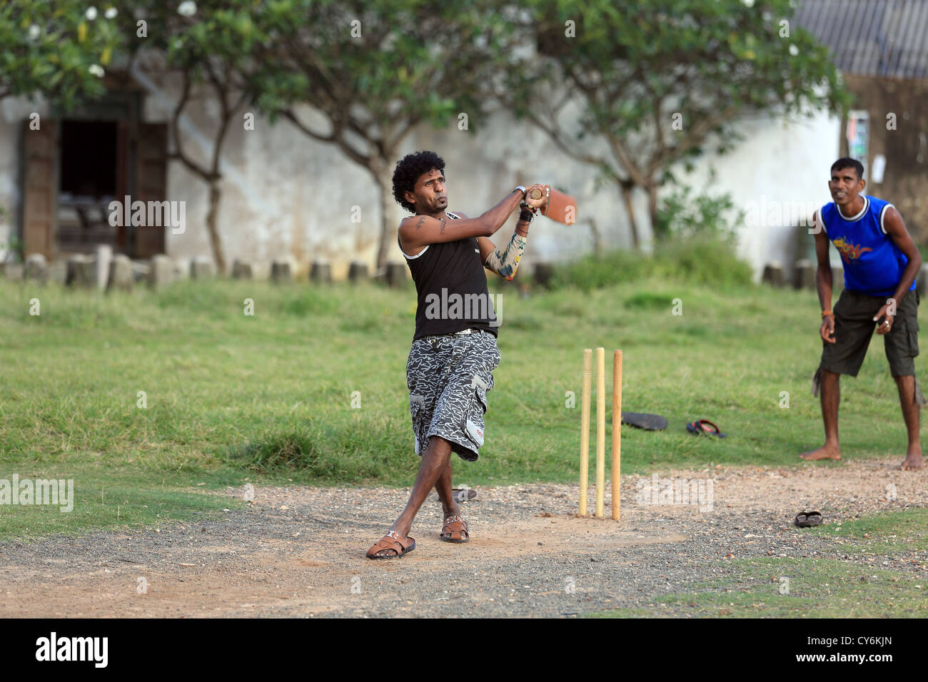 Sri Lankan boys playing cricket in the street inside Galle Fort. Stock Photo
