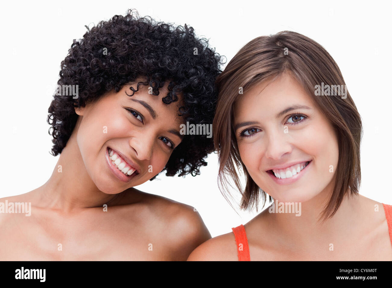 Teenage girls smiling and posing against a white background Stock Photo ...