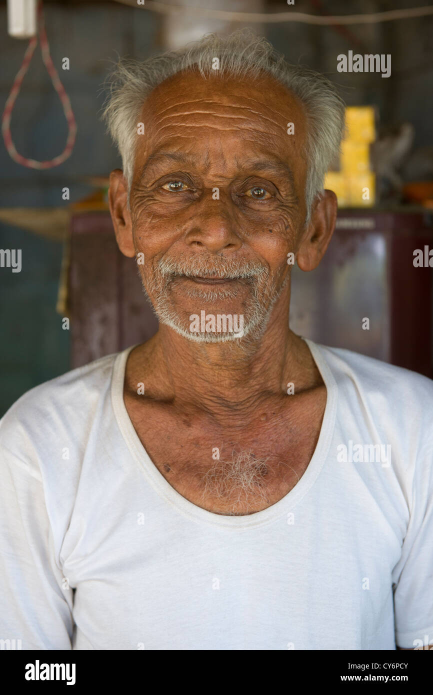 Shopkeeper in a roadside shop, Ambalappuzha, near Alappuzha (Alleppey), Kerala, India Stock Photo