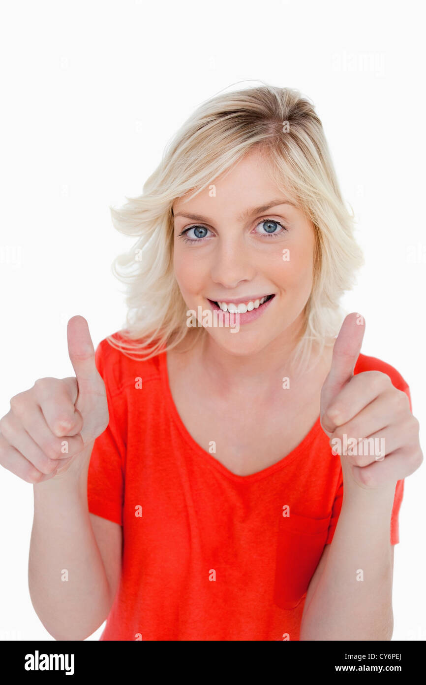 Teenage Girl Showing Her Thumbs Up And A Beaming Smile Stock Photo Alamy