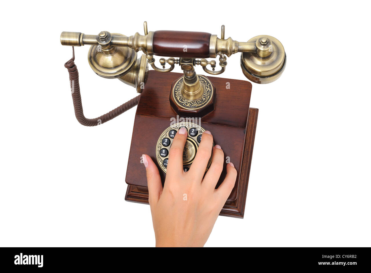 Female hand dialing number old-fashioned phone Stock Photo