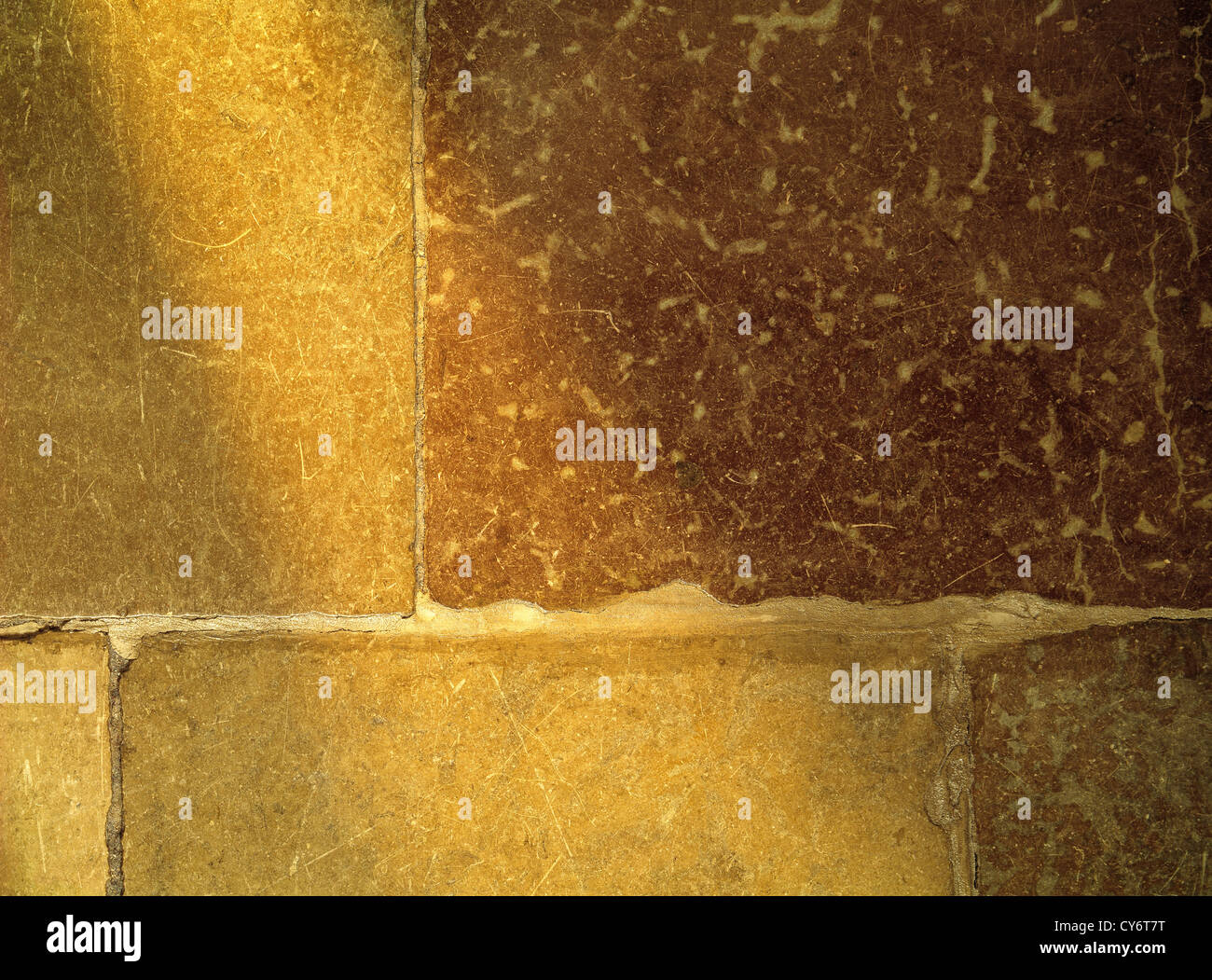 old brown stone floor with a ray of light from the left side, in the Old Town Stockholm Sweden. Landscape format. Stock Photo