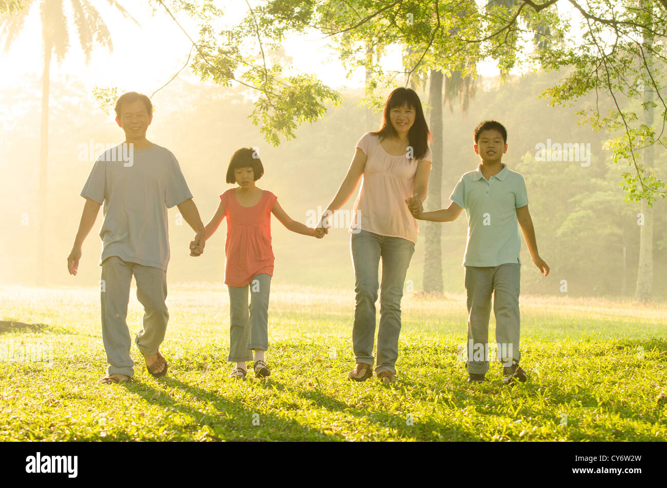asian family walking in the park Stock Photo - Alamy