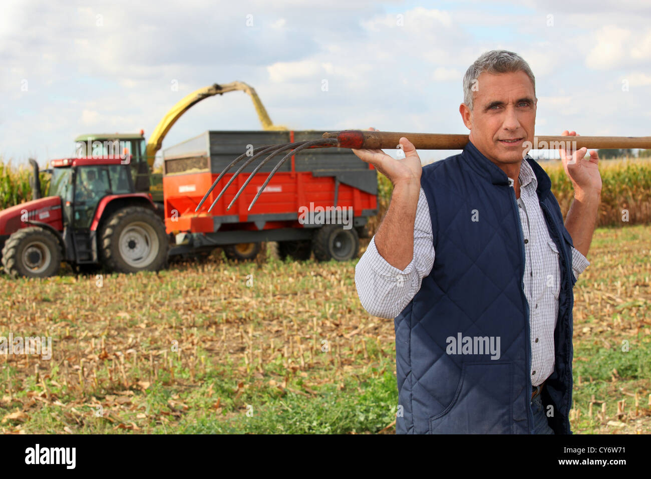 Farmer with pitchfork Stock Photo Alamy