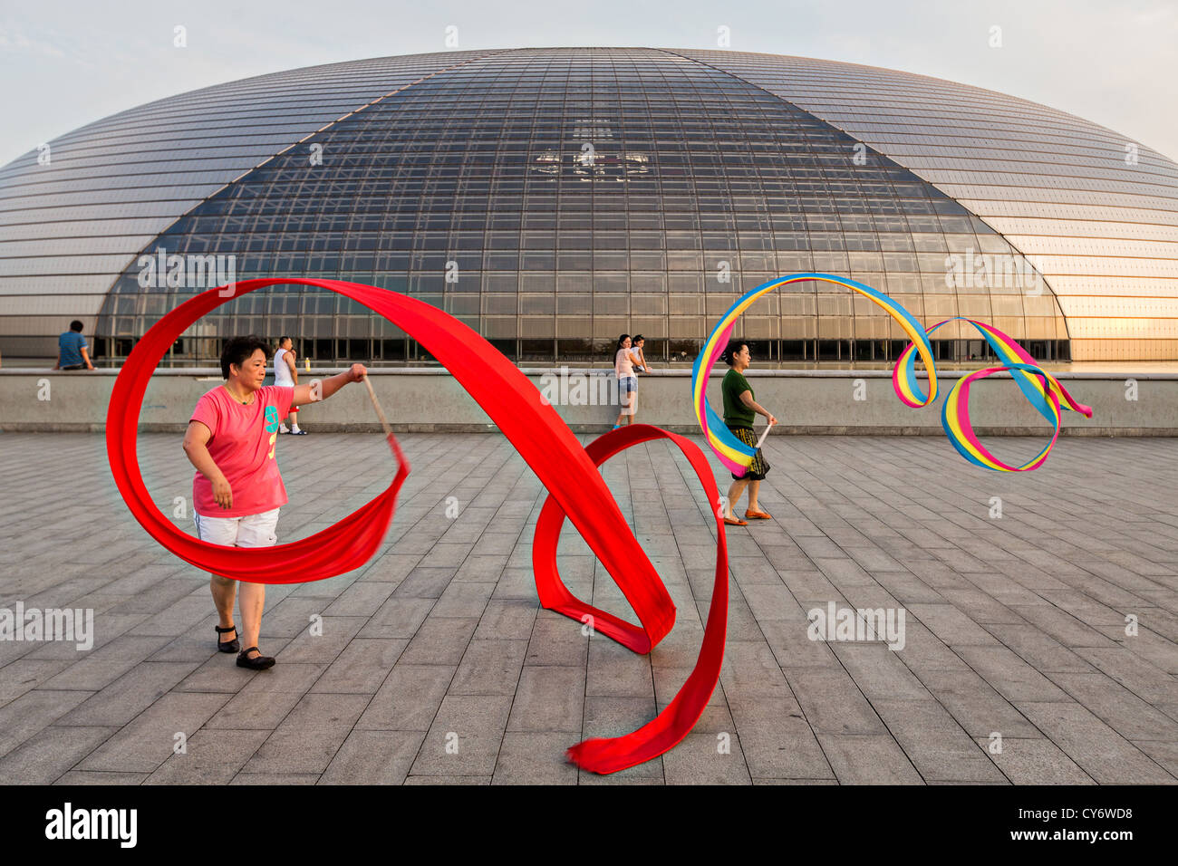 Women practice ribbon dancing at the National Centre for Performing Arts park in Beijing, China Stock Photo