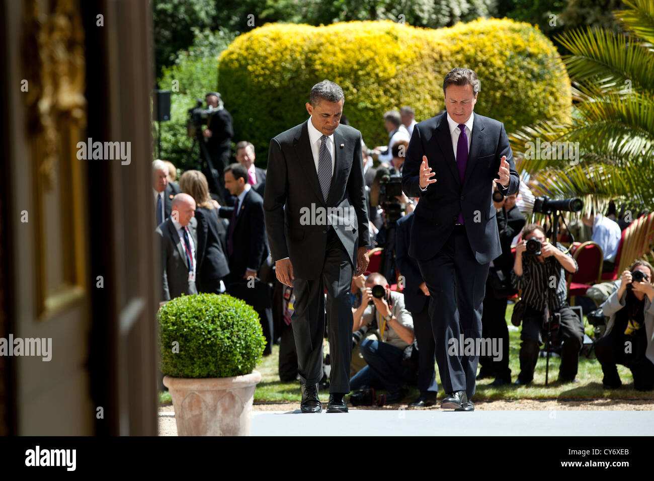 US President Barack Obama and British Prime Minister David Cameron walk together following their joint press conference at Lancaster House May 25, 2011 in London, England. Stock Photo