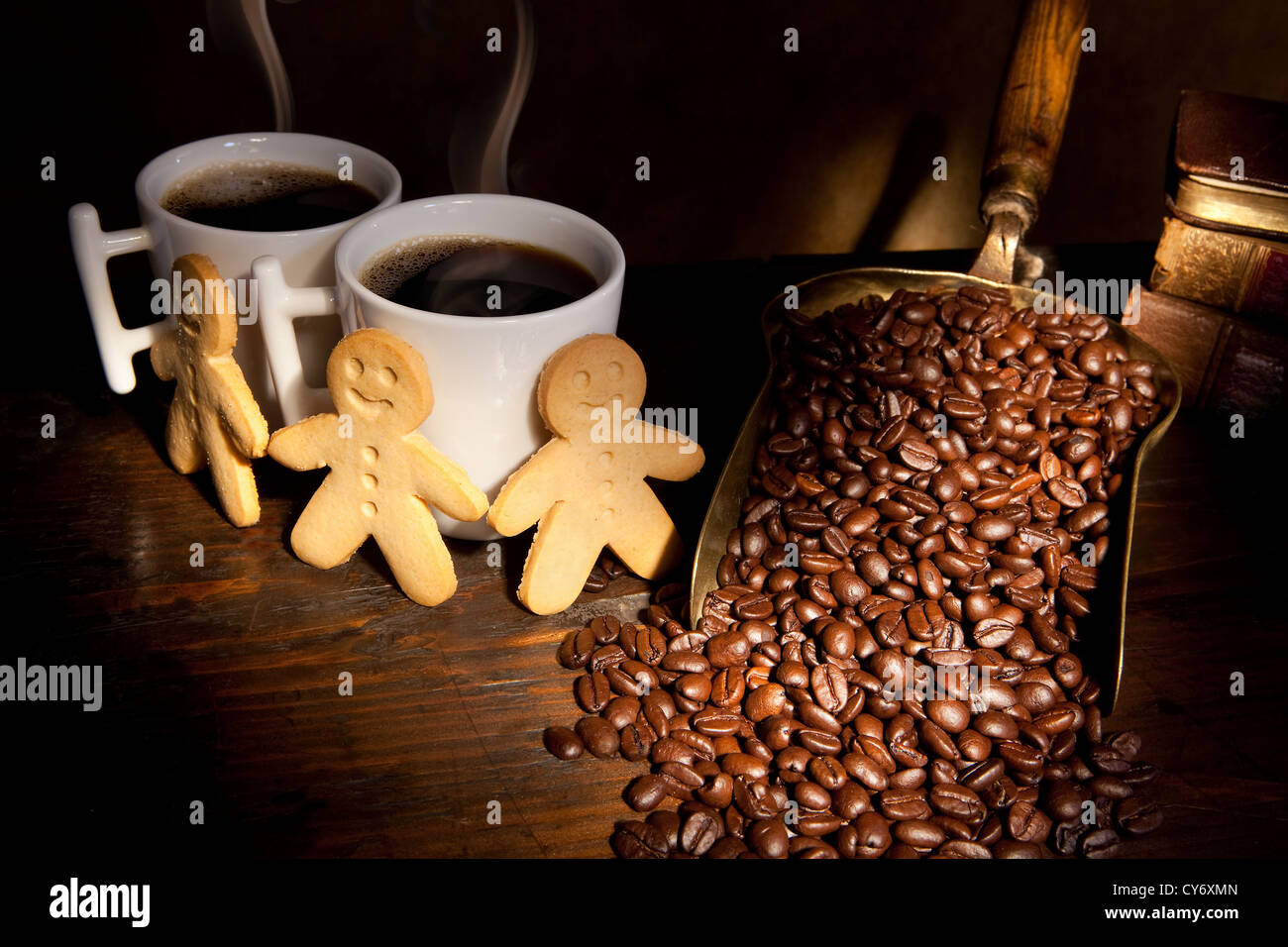 https://c8.alamy.com/comp/CY6XMN/gingerbread-men-standing-around-two-hot-coffee-cups-CY6XMN.jpg