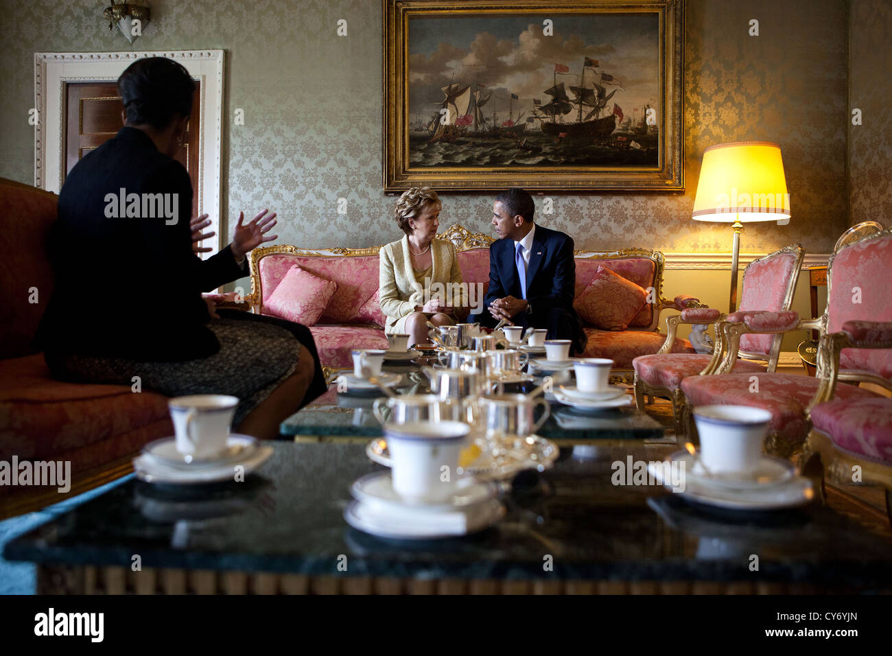 US President Barack Obama and First Lady Michelle Obama talk with Irish President Mary McAleese and Dr. Martin McAleese during a courtesy call in the Drawing Room at the PresidentÕs residence May 23, 2011 in Dublin, Ireland. Stock Photo