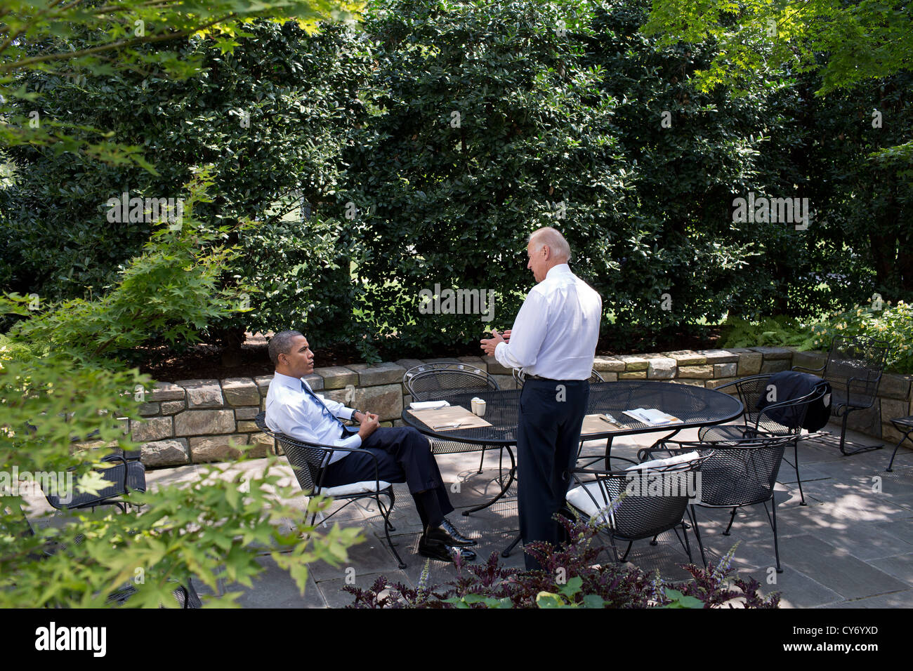 US President Barack Obama and Vice President Joe Biden have lunch on the patio outside the Oval Office August 30, 2012. Stock Photo