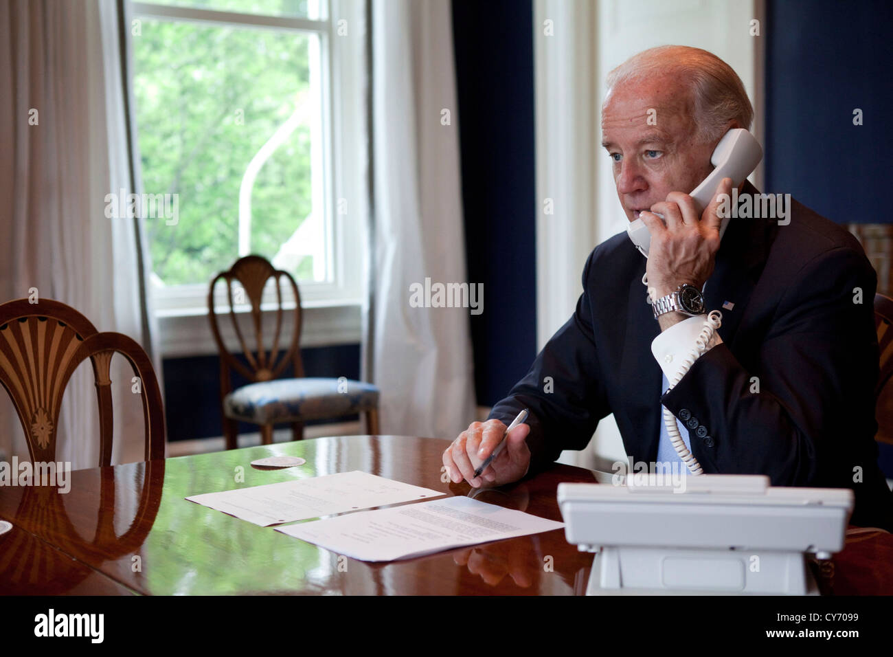 Vice President Joe Biden calls Frances Soehartono, a Chrysler employee at the Jefferson North Plant in Michigan to thank her for her work at Chrysler and for Chrysler's repayment of US Government loans ahead of schedule May 24, 2011 in Washington, DC Stock Photo